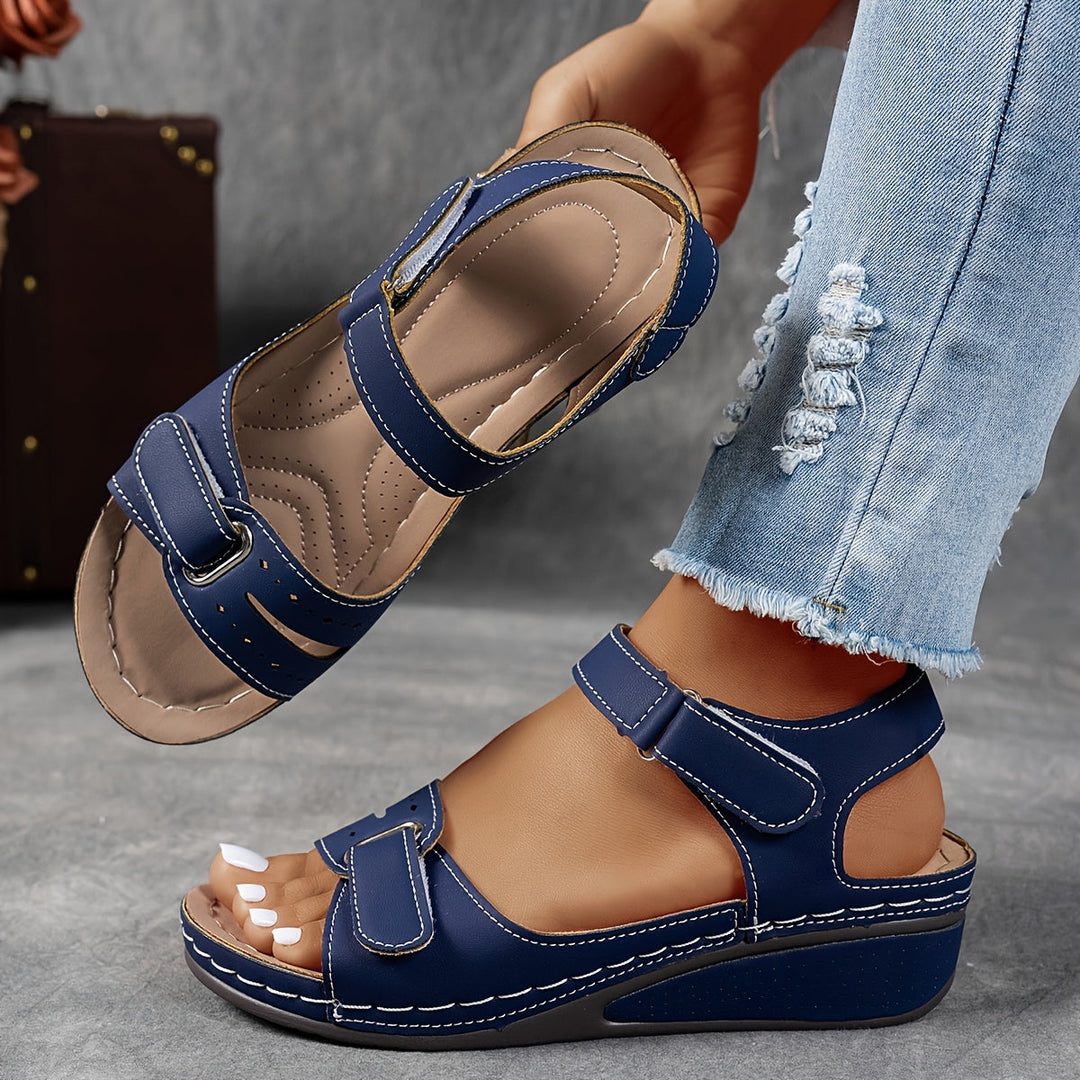 Stylish women's platform sandals with adjustable straps and open toe, designed for warm weather comfort.