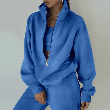 Woman lounging in her comfortable 2-piece activewear set, versatile as loungewear or yoga clothes.