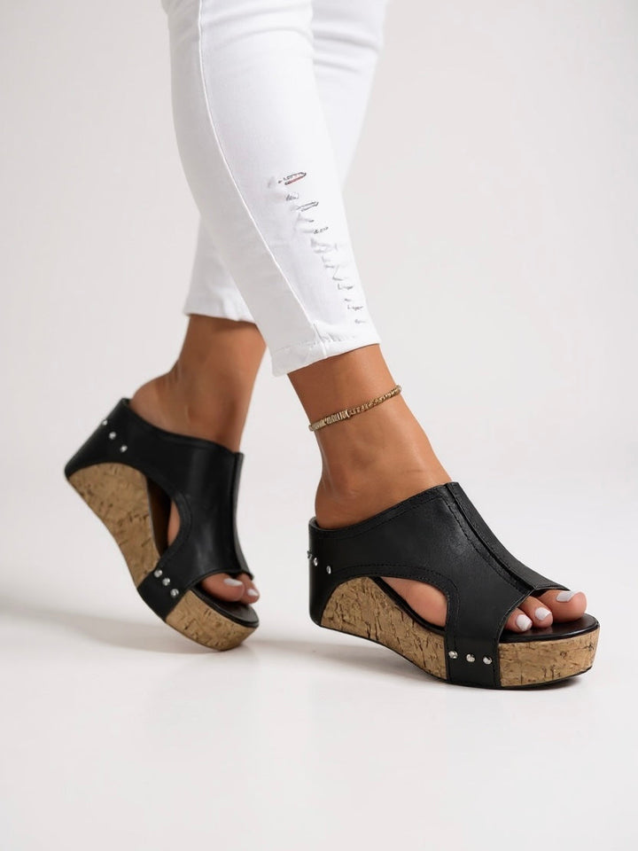 Women's comfortable black wedge slide sandals, ideal for casual elegant summer style.