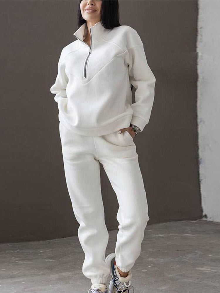 Versatile women's athleisure tracksuit, including a chic zip neck top & modern tapered trousers for comfort.