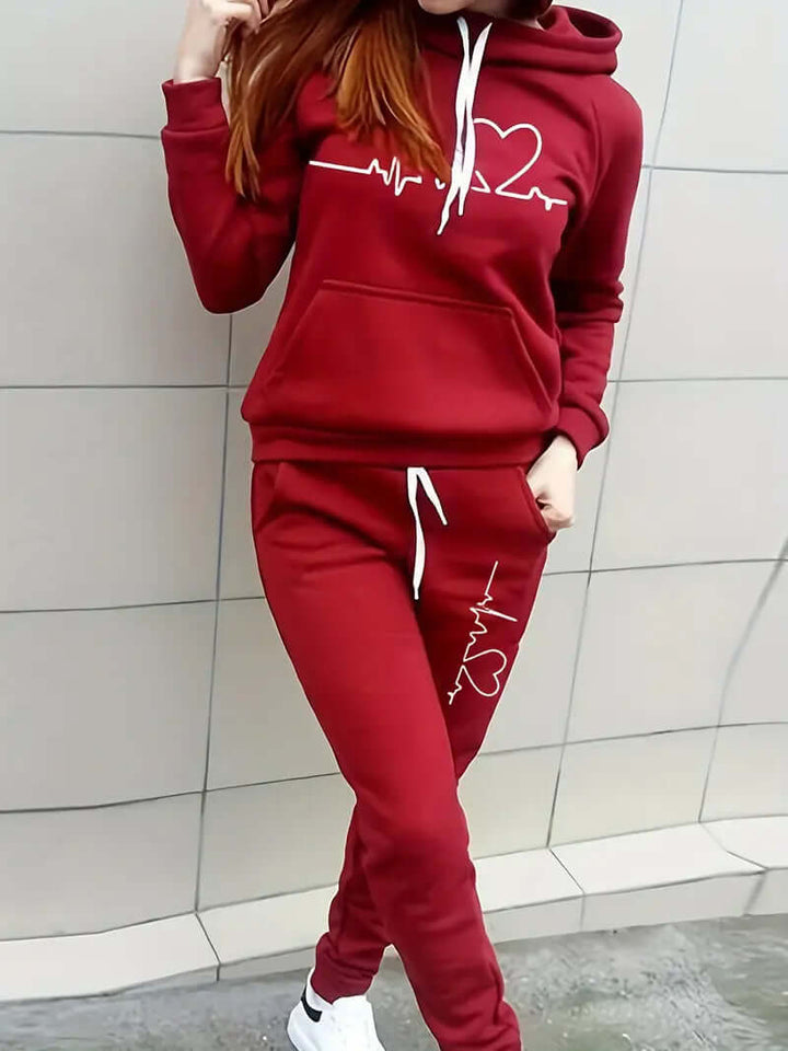 Athletic women's two-piece cotton blend activewear set; cozy hoodie and matching pants for workouts.
