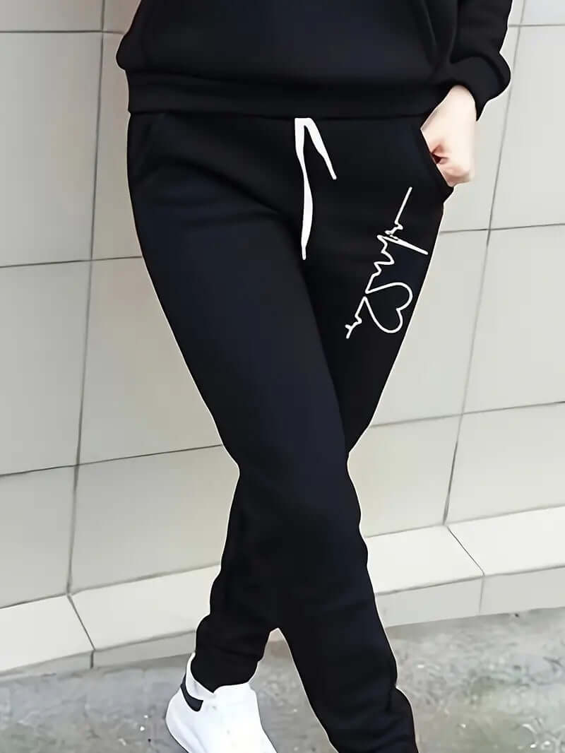 Woman modeling a stylish cotton blend sportswear hoodie and pants set, ideal for active or casual wear.