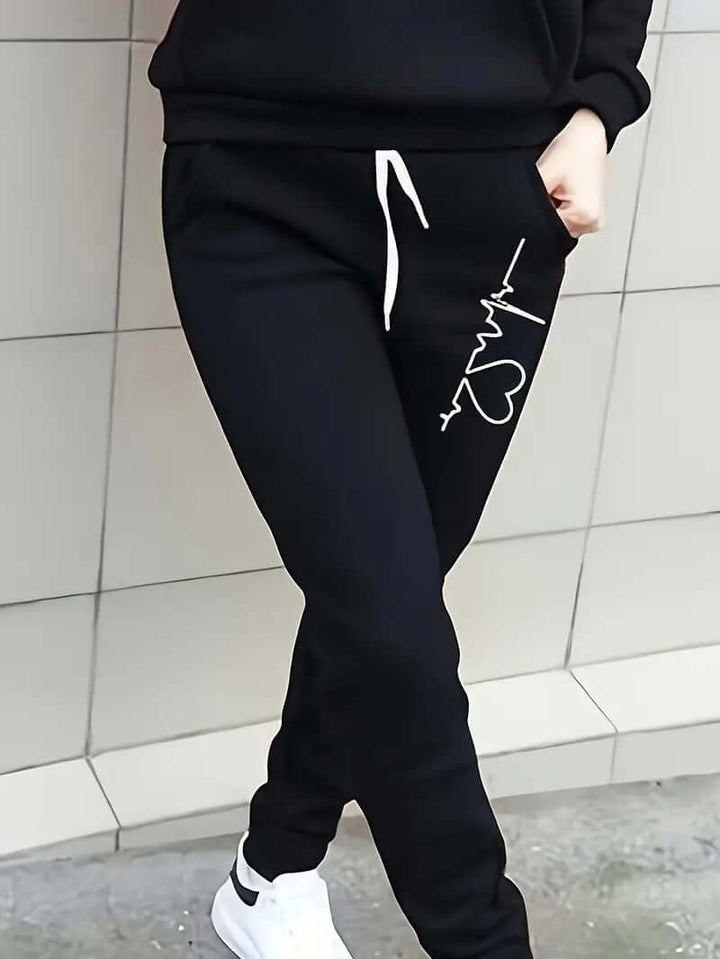 Woman modeling a stylish cotton blend sportswear hoodie and pants set, ideal for active or casual wear.