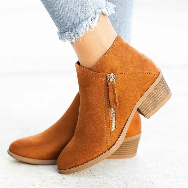 Comfortable women's everyday ankle boots, versatile for winter & casual wear. Features side zipper & non-slip sole.