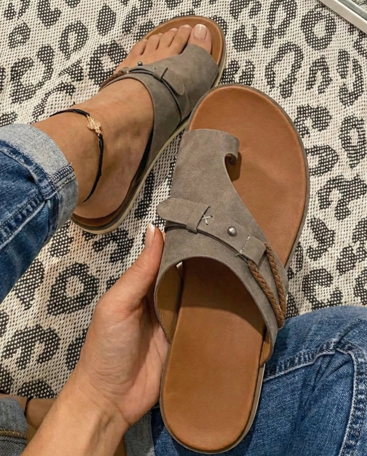 Women's comfortable toe loop flat sandals, perfect for summer vacations, beach walks, or casual everyday comfort.