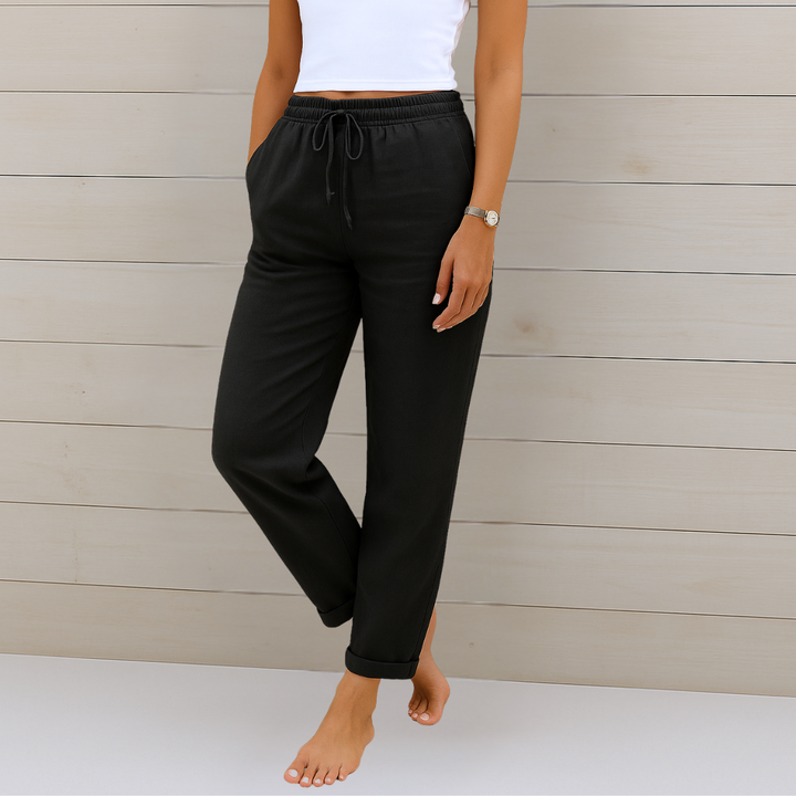 Neutral flowy women's pants with elastic waist, offering ultimate comfort and versatile everyday fashion.