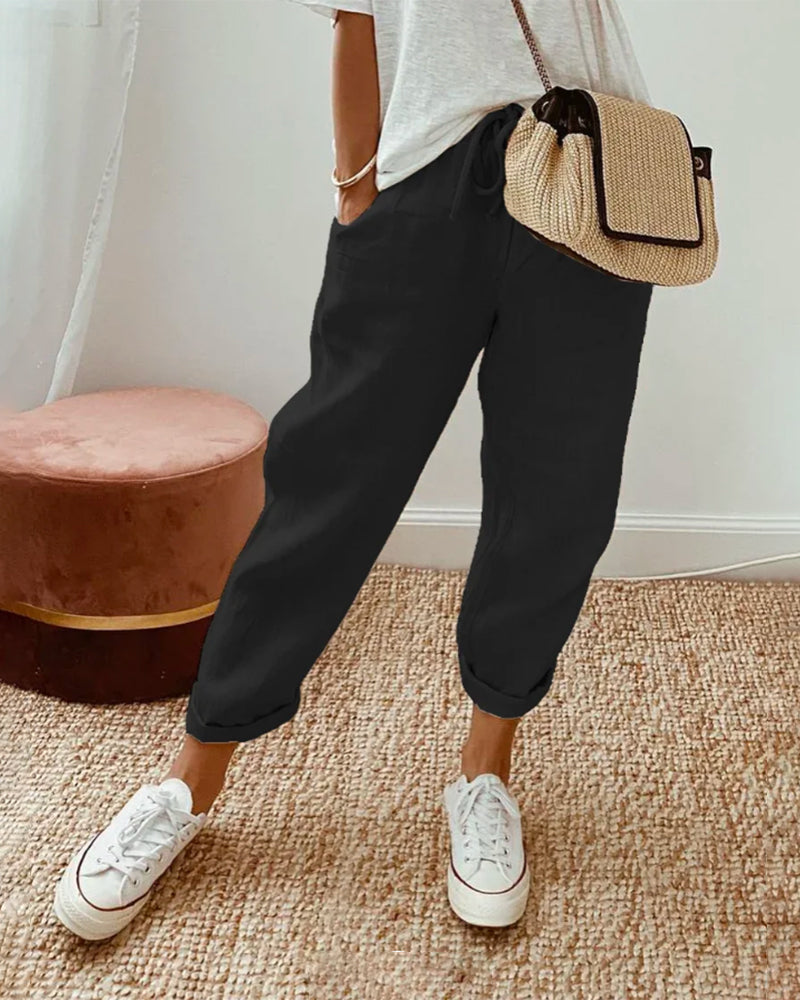 Elegant women's high-waist trousers, ideal for office attire. Comfortable & stylish versatile pants for work.