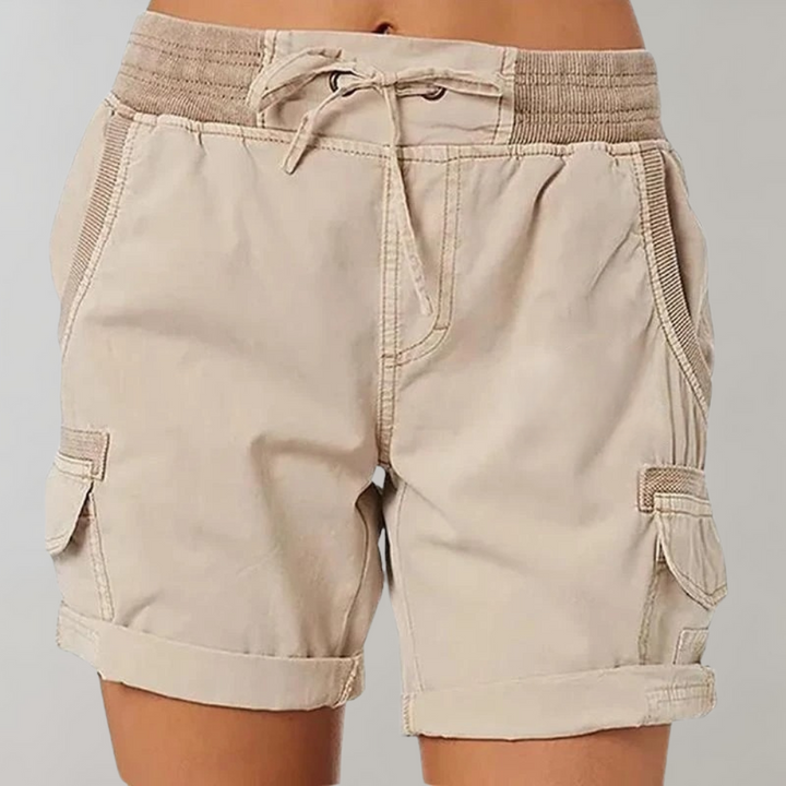 Stylish women's multi-pocket cargo shorts with elastic waist, ideal for comfortable casual wear & outdoor adventures.