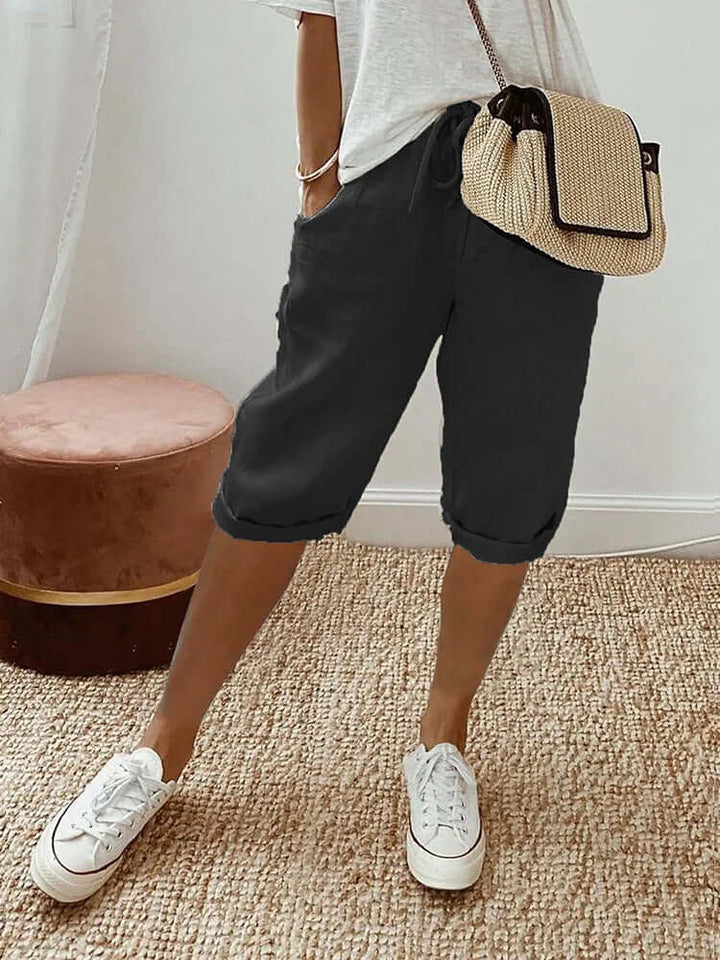 Women's comfortable knee-length drawstring pants, ideal for casual summer wear & everyday comfort.