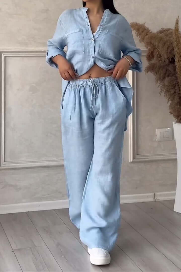 Women's stylish linen two-piece outfit with relaxed top & pants, perfect for breezy summer fashion.