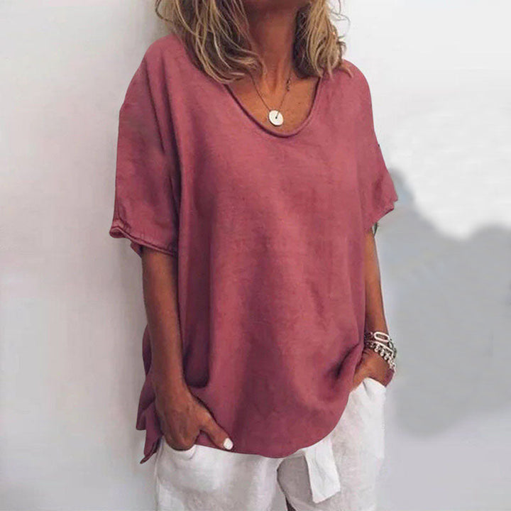 Stylish woman wearing a comfortable loose fit blouse, ideal for casual, everyday, or work appropriate fashion.