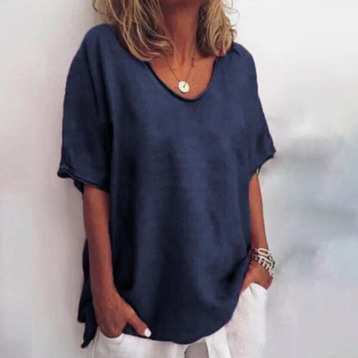 Comfortable women's loose fit blouse, versatile for effortless casual wear or elegant work style. Everyday top.
