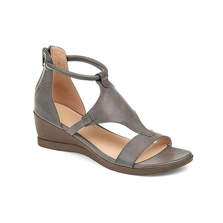 Everyday women's sandals with a comfortable wedge heel, faux leather material