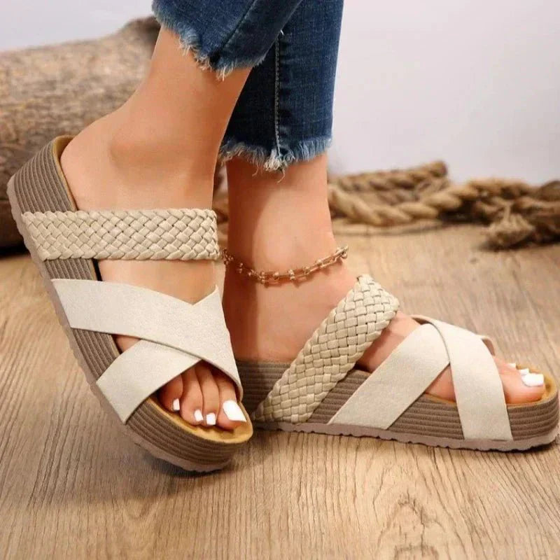 Pair of women's comfortable walking sandals with elastic straps, offering orthopedic arch support