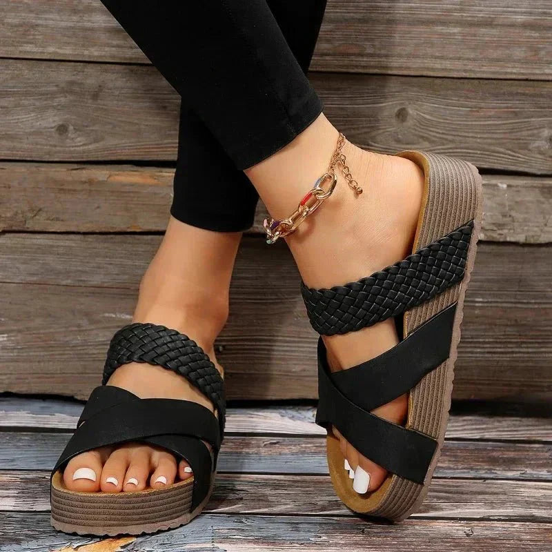 Close-up of women's orthopedic sandals, highlighting the elastic straps and comfortable footbed