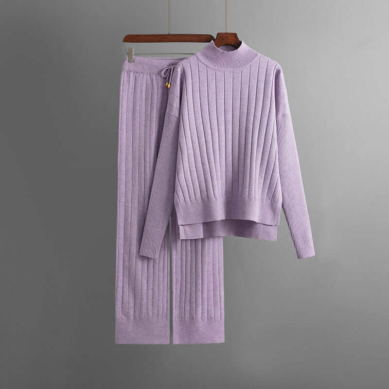 Stylish women's ribbed knit lounge set featuring a cozy turtleneck top and comfortable, elegant trousers.