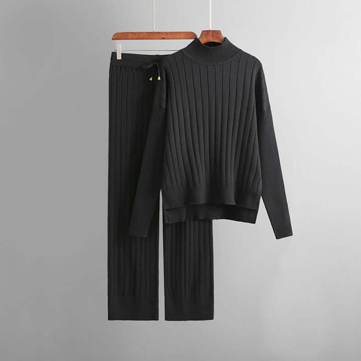 Cozy women's two-piece ribbed knit set with a chic turtleneck top and comfortable trousers for home or casual wear.