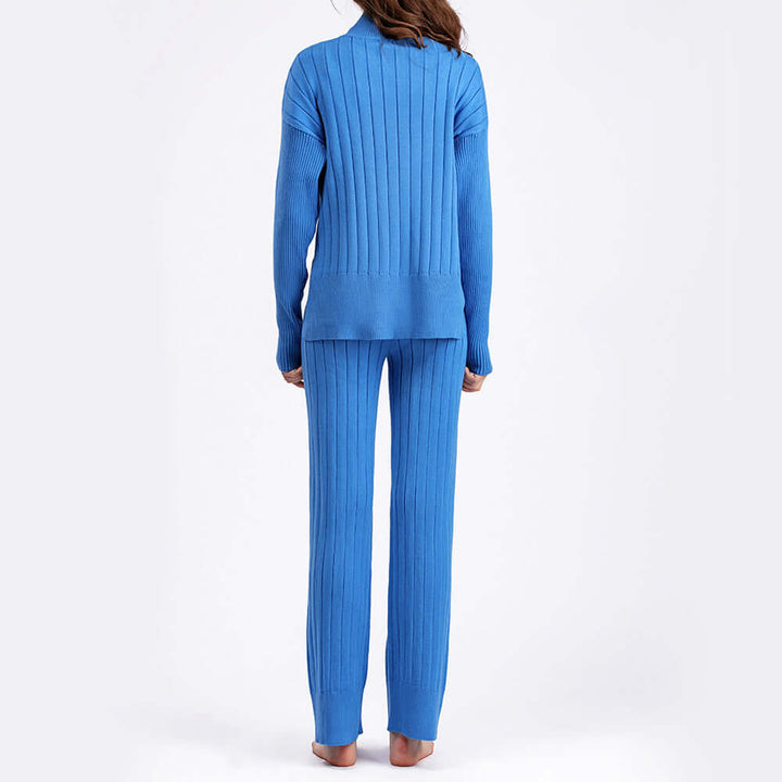 Versatile women's ribbed knit lounge set, a two-piece ensemble with a cozy turtleneck top and comfortable wide-leg pants.