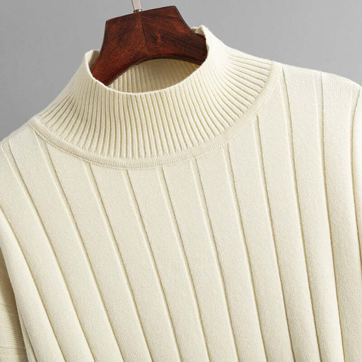 Fashionable women's ribbed knit lounge set, a comfortable two-piece featuring a modern turtleneck and relaxed trousers.