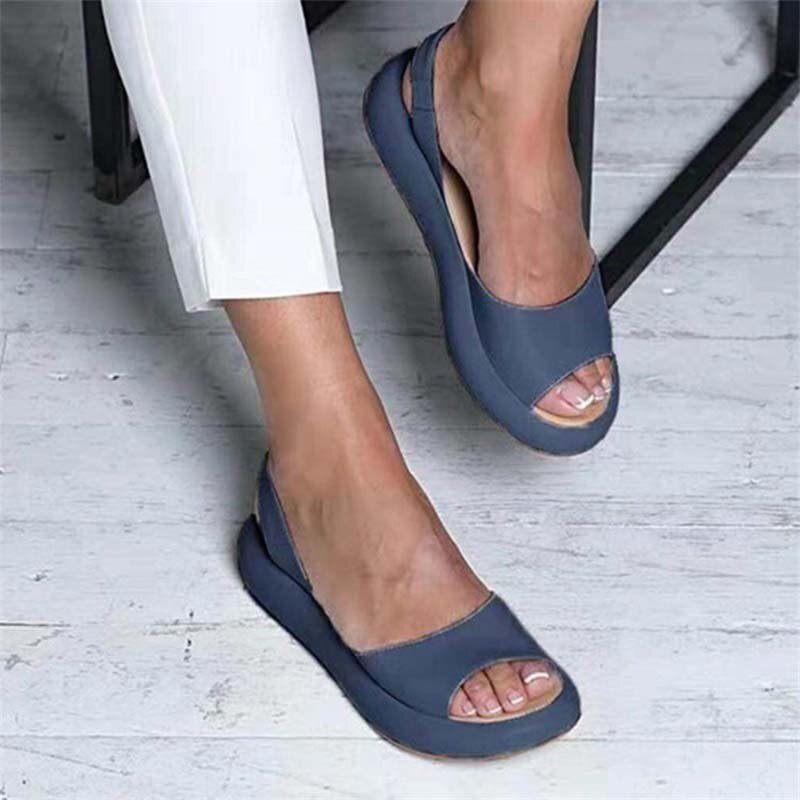 Close-up of comfortable women's slip-on sandals with soft elastic strap for easy summer style.