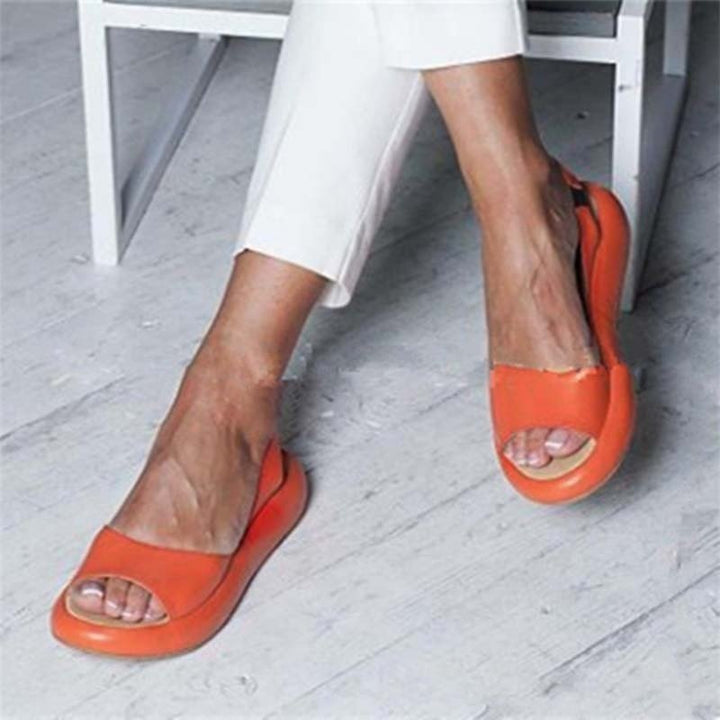 Pair of women's comfortable summer sandals, designed as slip-ons with elastic for a snug fit.