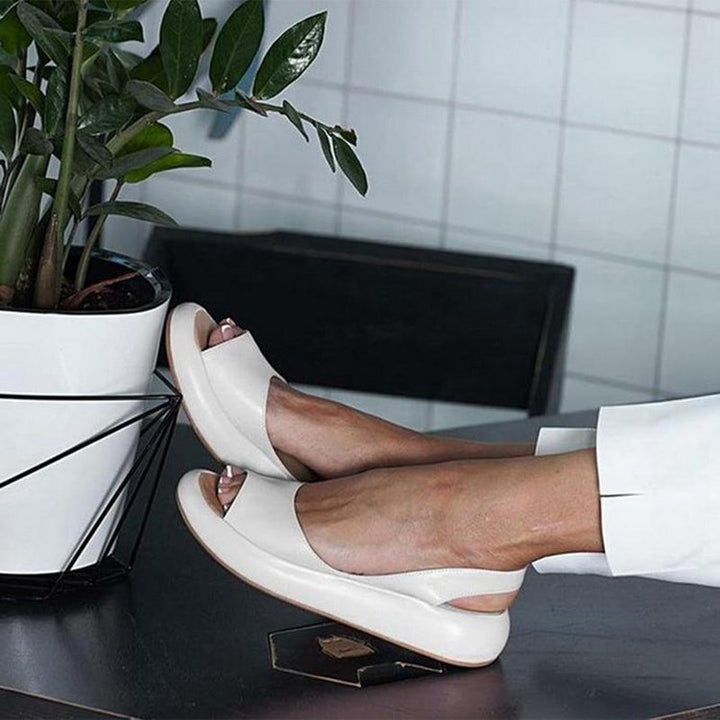 Vacation-ready women's slip-on summer sandals featuring wide, comfortable elastic straps.