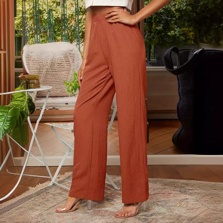 Navy blue women's straight-leg trousers, elastic waist for a comfortable, casual, versatile look.