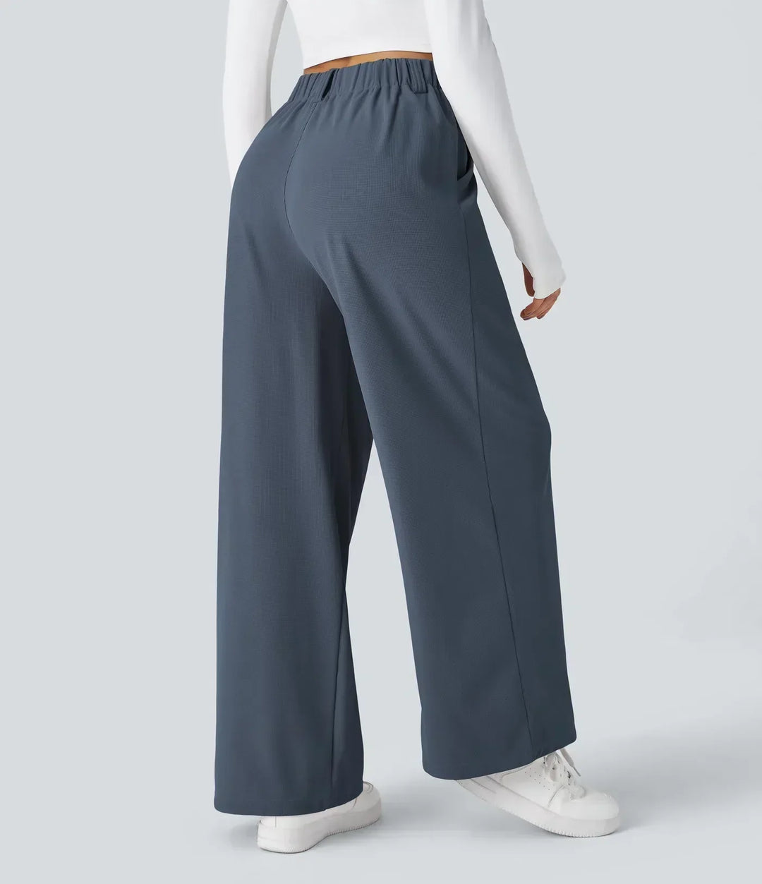Detail of waistband on women's comfortable stretch pants, designed for a perfect, flexible fit. Everyday women's trousers.