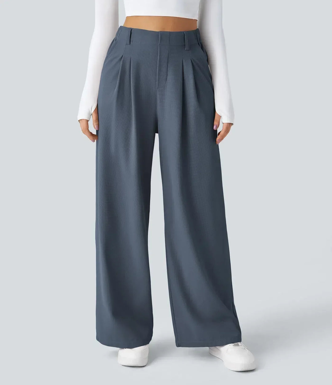 Woman walking in comfortable stretch trousers, showcasing flexible movement & versatile style. Active women's pants.