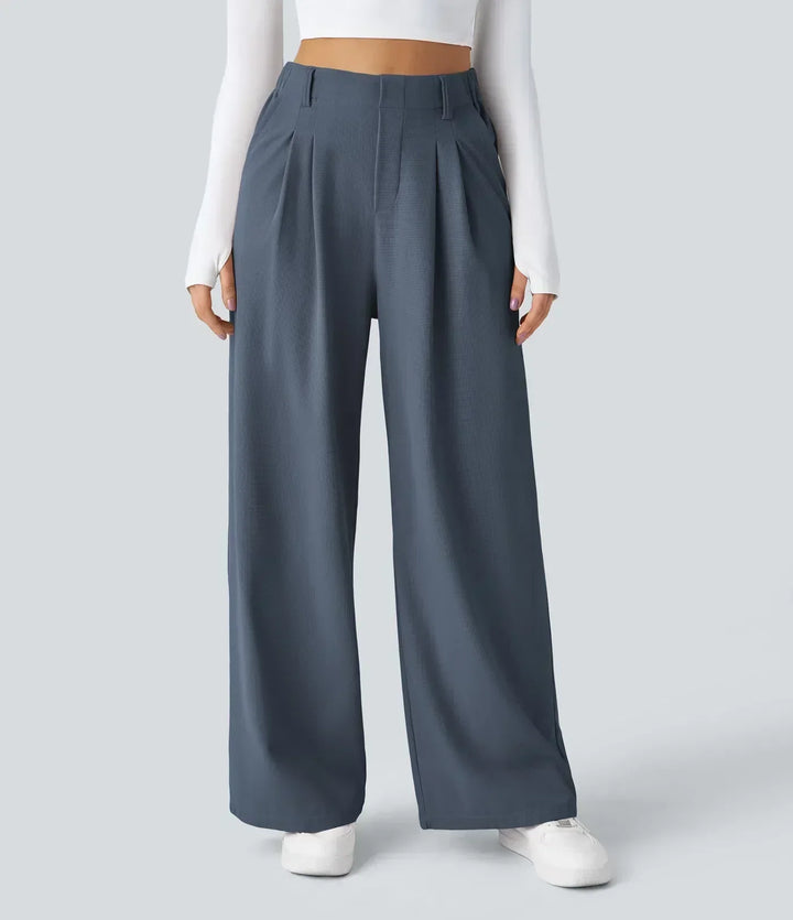 Woman walking in comfortable stretch trousers, showcasing flexible movement & versatile style. Active women's pants.