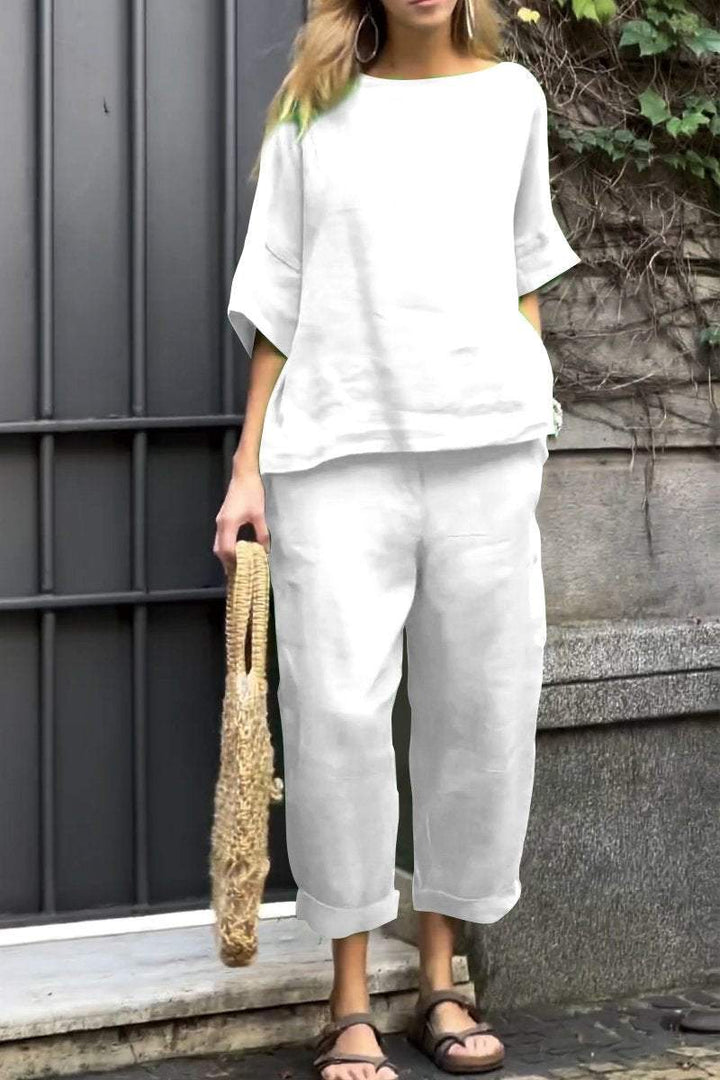 Soft women's two-piece outfit with a long-sleeve shirt and matching wide-leg pants for comfort.