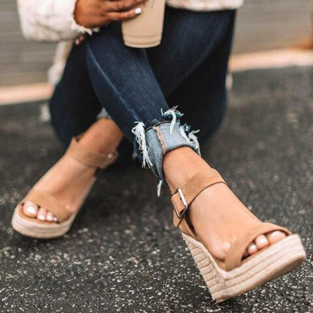 Solid color women's T-strap wedge sandals with buckle closure. Comfortable platform sandals for summer leisure.
