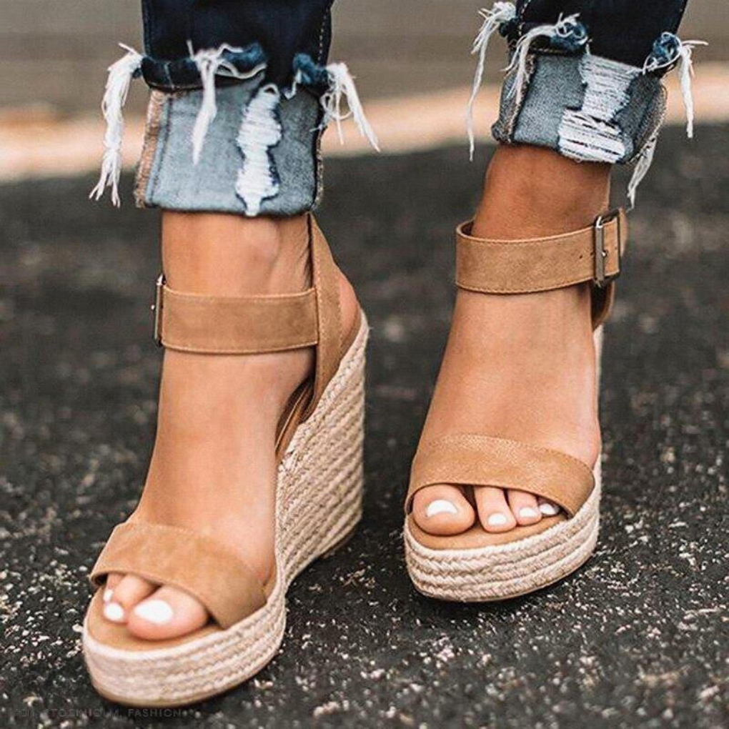 Stylish women's T-strap wedge sandals offering all-day comfort. Ideal summer casual footwear with a platform design.