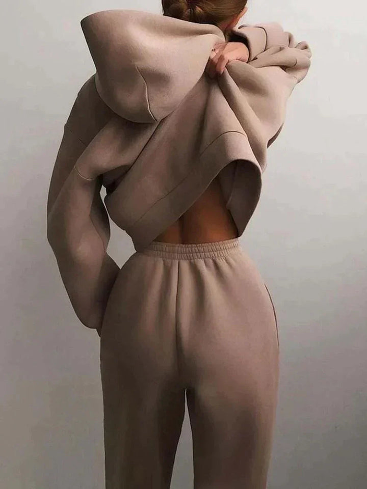 Relaxed fit women's two-piece loungewear set. Comfortable hoodie & joggers for matching casual style.