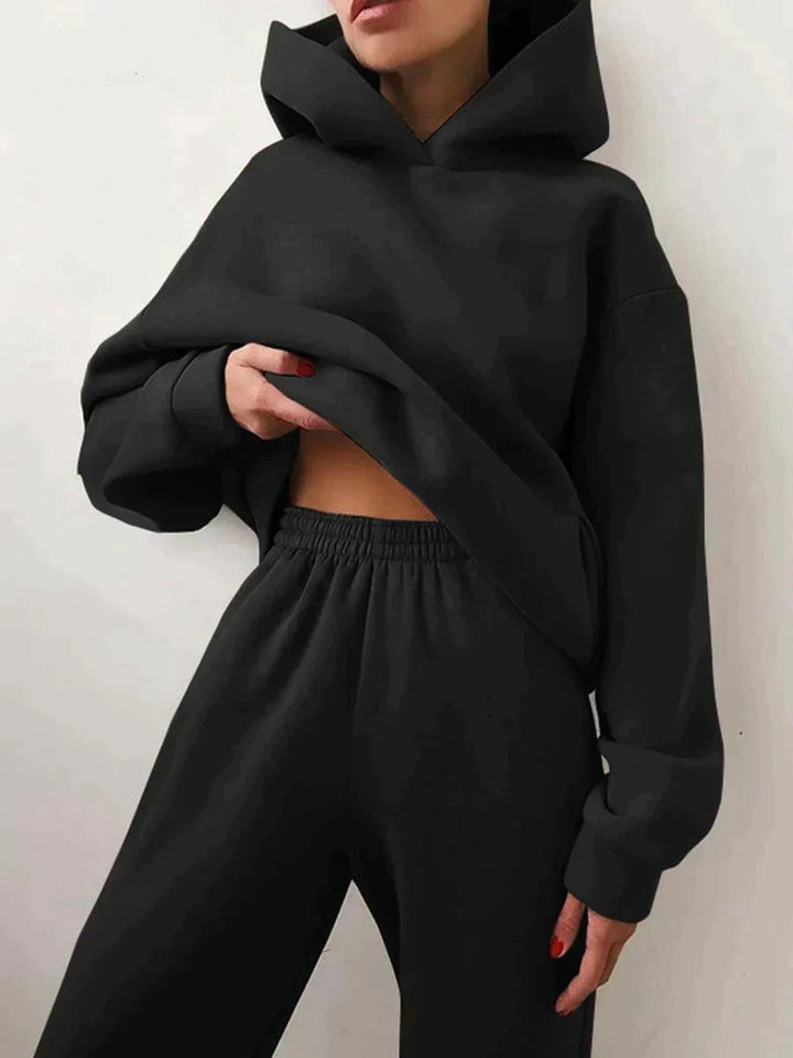 Stylish women's matching two-piece set, a cozy jogging hoodie and pants for ultimate comfort.