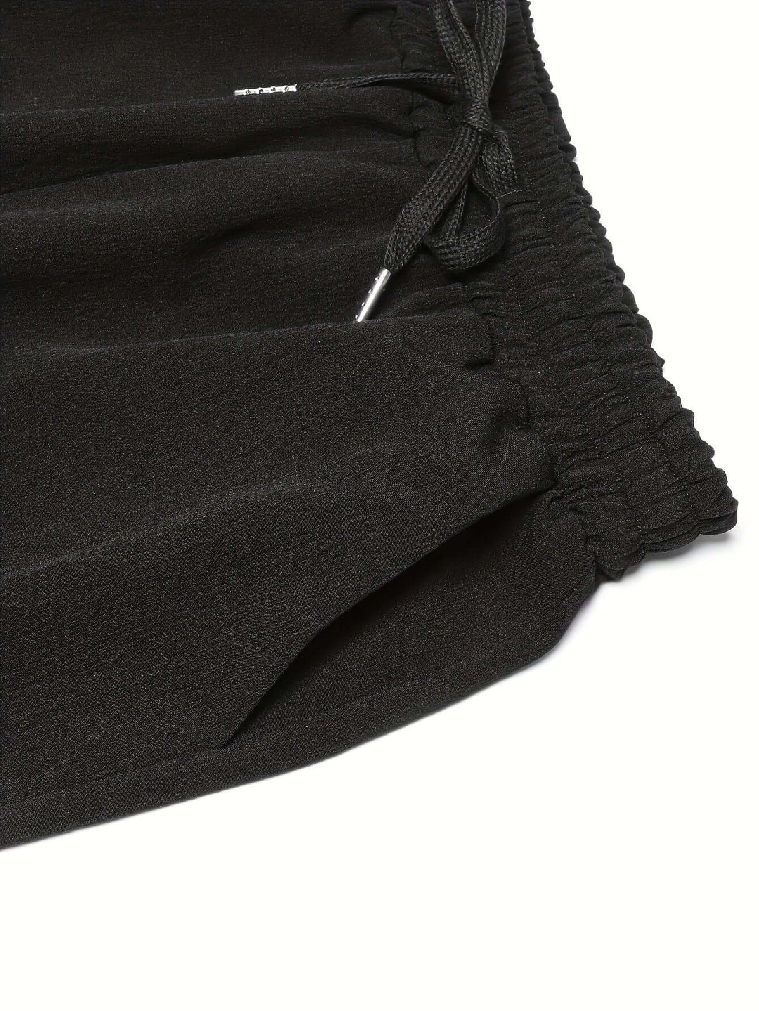 Soft women's wide-leg trousers with an elastic drawstring waist and deep pockets, designed for ultimate comfort and style.