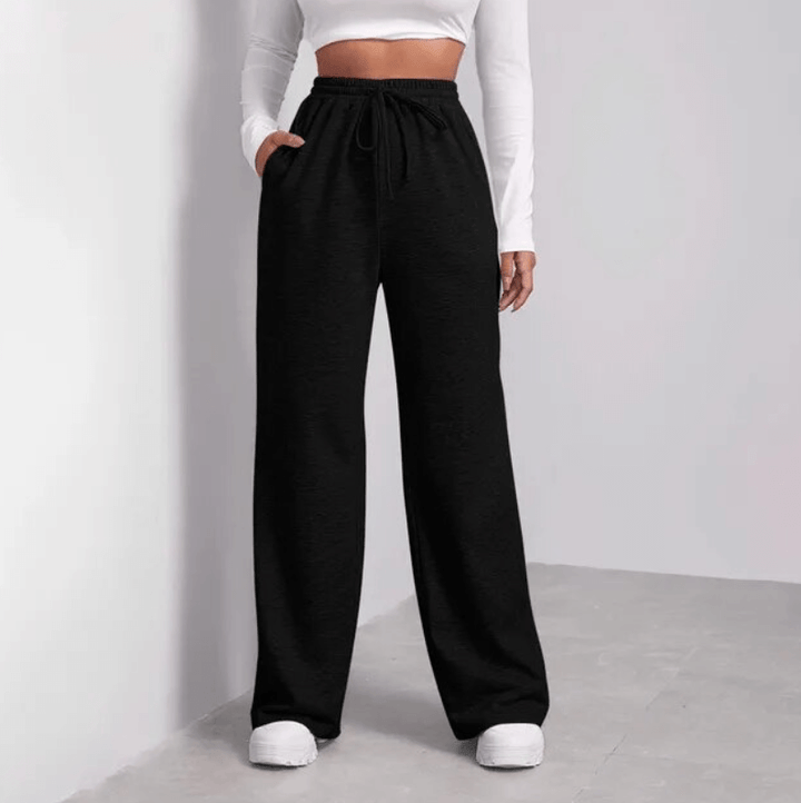 Women's comfortable wide-leg trousers with drawstring waist in a relaxed fit. Perfect casual summer pants.