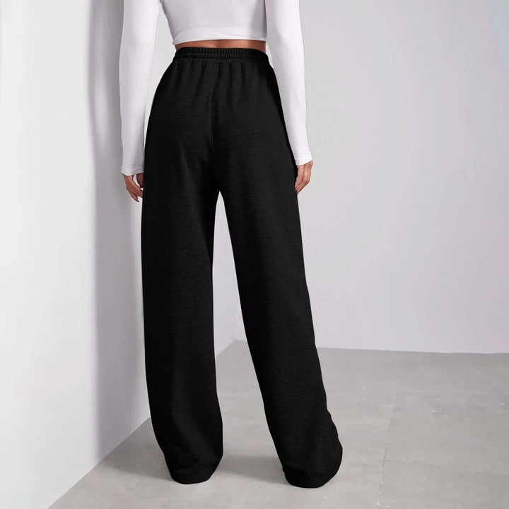 Relaxed fit wide-leg trousers for women, featuring a comfortable drawstring waist. Ideal casual summer pants.