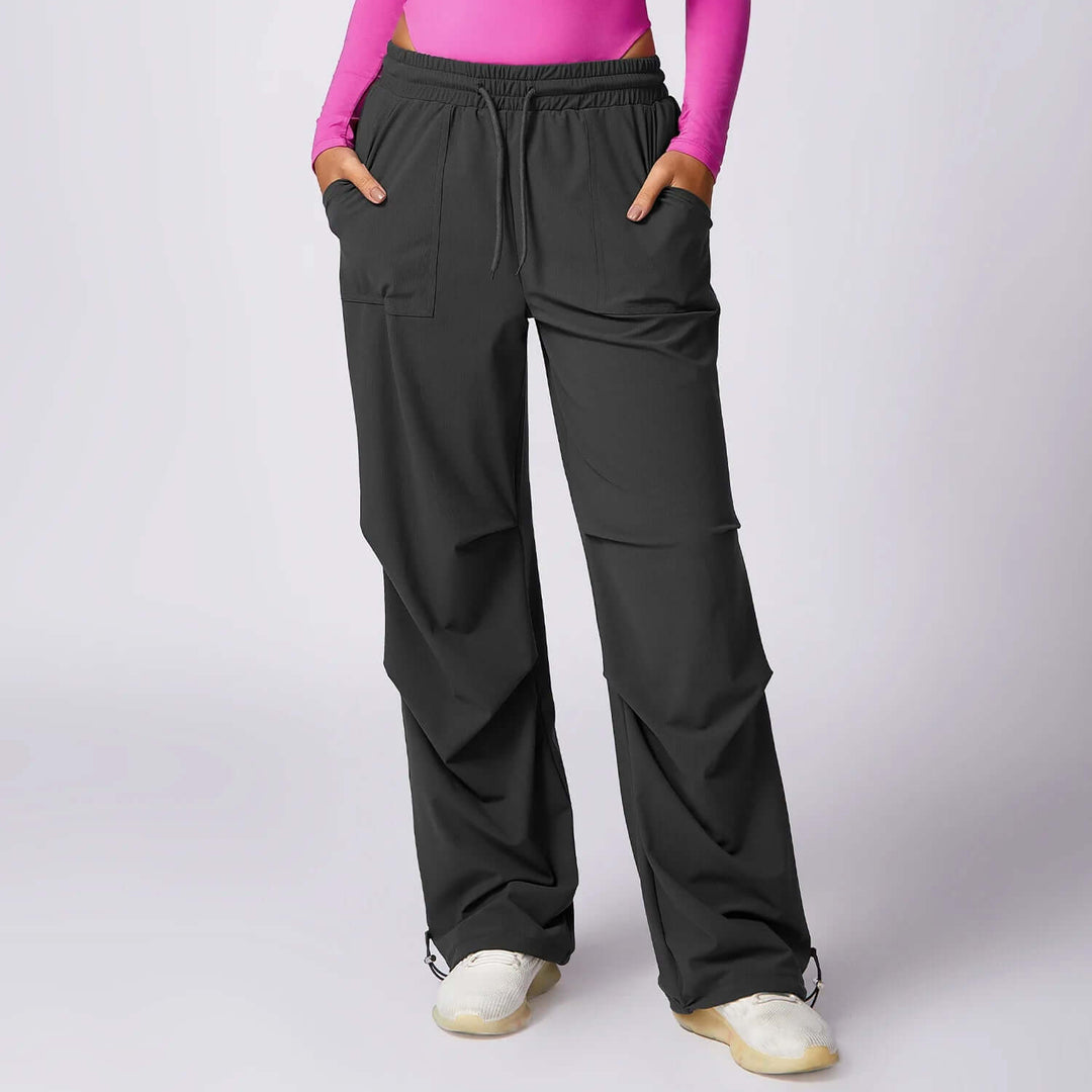 Comfortable women's drawstring wide-leg pants with elastic waist and utility pockets, ideal for casual fashion.