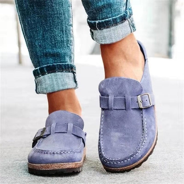 Black women's slip-on clogs, ideal comfort footwear and casual sandals for versatile everyday wear.
