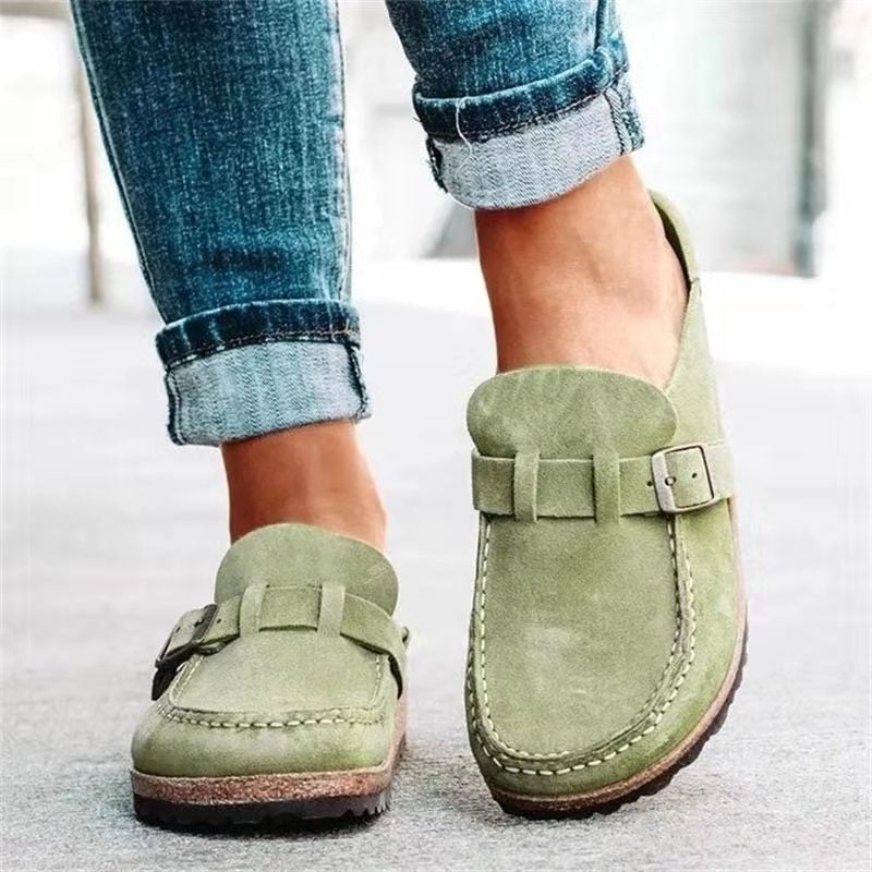 Lightweight women's slip-on clogs in green, offering ultimate comfort and versatile style as casual everyday sandals.