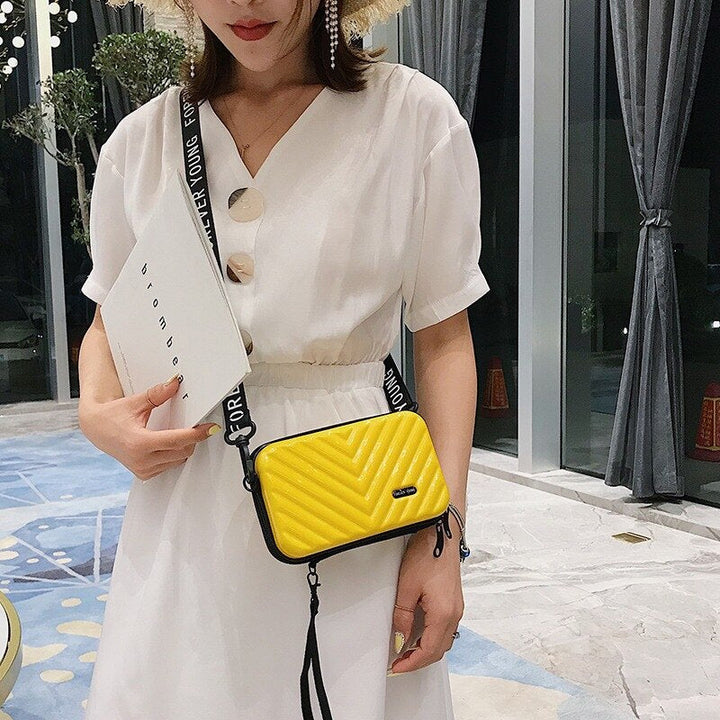 Women's compact hard shell travel handbag. Versatile crossbody with organizer for secure essentials.