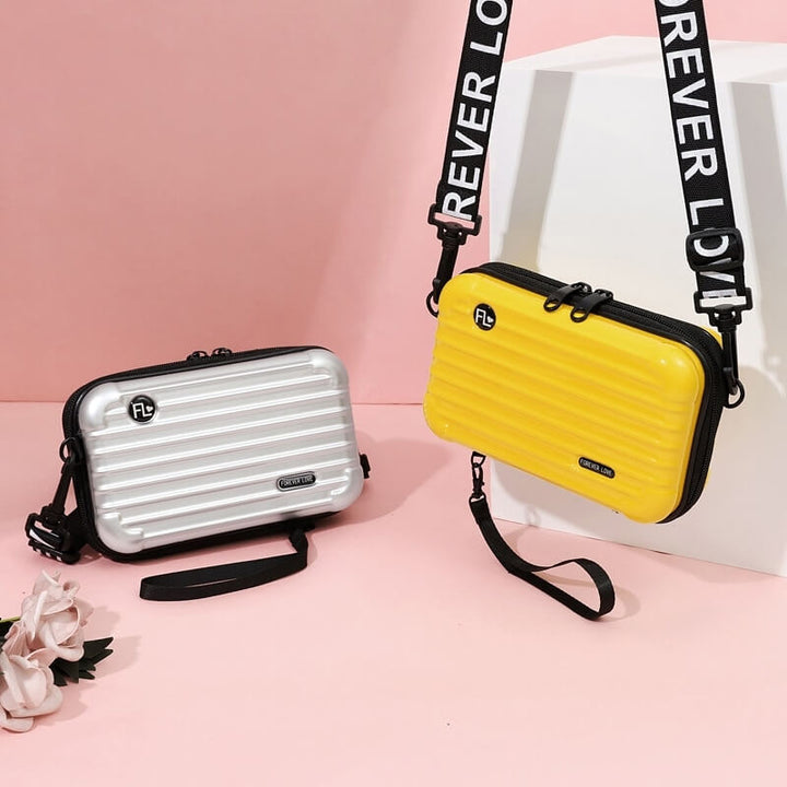 Women's secure hard shell travel handbag. Compact crossbody bag, great for organized essentials.
