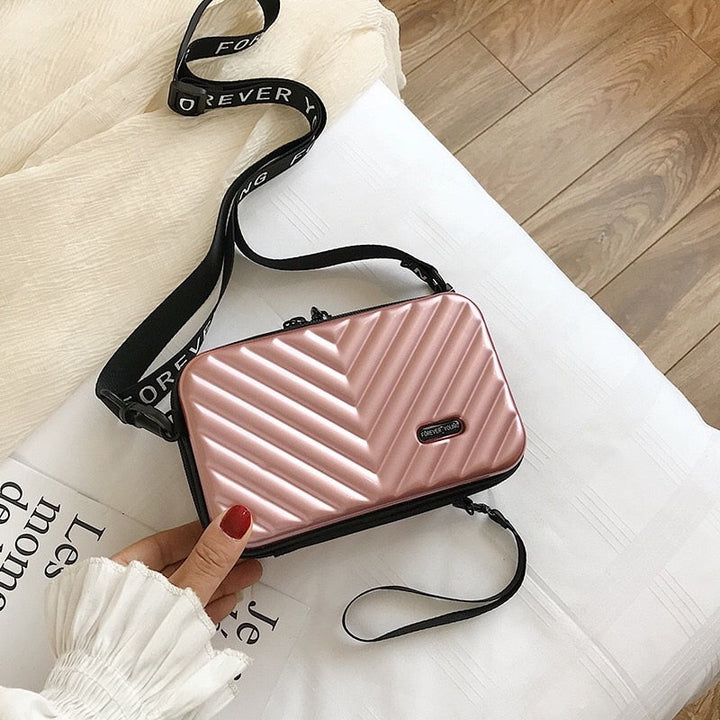 Women's stylish hard shell travel handbag. Organizer crossbody bag, perfect for on-the-go security.