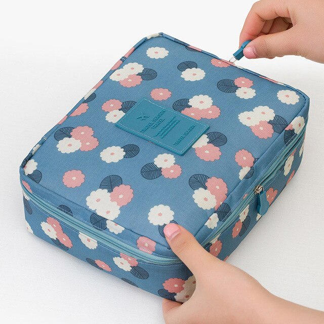 Chic leopard print compact waterproof cosmetic case for women's travel and daily use.
