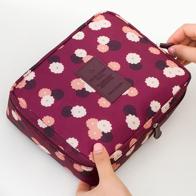 Durable waterproof compact makeup travel organizer, protecting women's cosmetics from spills.