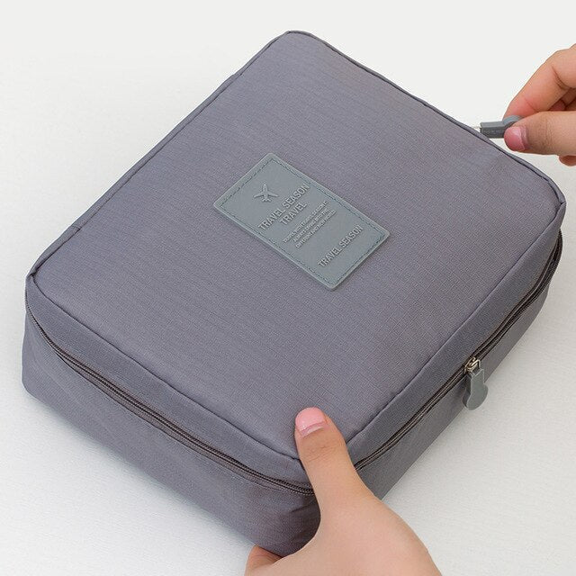 Convenient women's compact waterproof makeup organizer, ideal for quick travel packing.