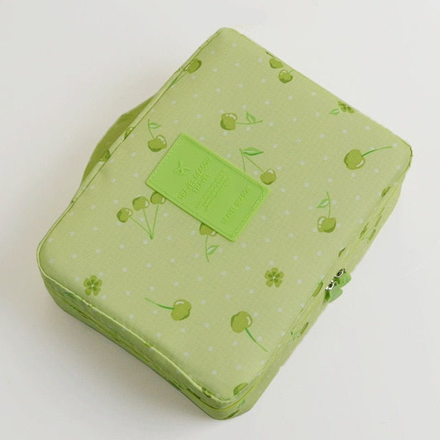 Collection of women's compact waterproof makeup organizers in various prints and sizes.