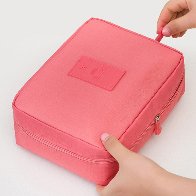 Spacious compact waterproof makeup travel organizer for women's beauty essentials on the go.
