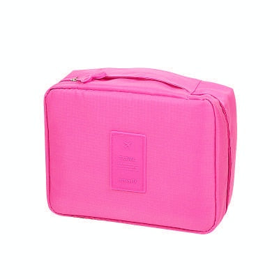 Open compact waterproof makeup organizer, revealing compartments for women's beauty items.